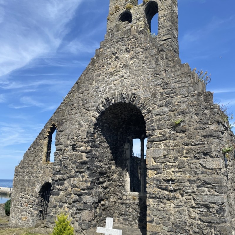 St Mary's Abbey ruins in Howth, medieval stone tower above the harbour